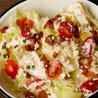 Wedge Salad · Iceberg lettuce, house ranch, heirloom tomato, bacon, bleu cheese, shallots, chives