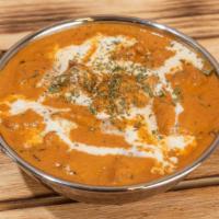 Butter Chicken · Mild curry has tender chunks of chicken simmered in a creamy spiced curry sauce. Served with...