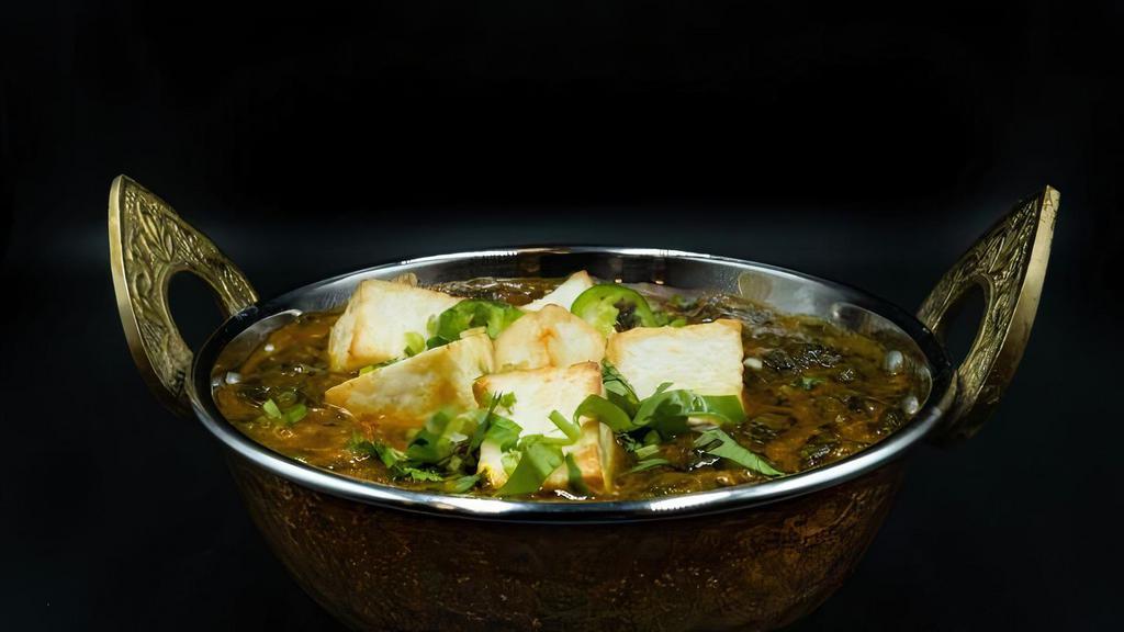 Palak Paneer · Cottage Cheese mixed with a creamy spinach sauce, infused with spices