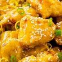 Orange Chicken · Crispy breaded chicken glaces with a sweet tangy orange sauce. Served with choice of side.