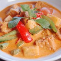 Pineapple Curry · Pineapple Curry begins at Medium spicy.
With basil, bell pepper, green bean, tomato and pine...