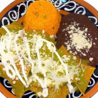 Chilaquiles Verdes · Green Chilaquiles salsa on corn Tortilla chips served with choice of protein.
