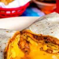 Chile Relleno Burrito · Green chile stuffed with cheese cooked in an egg batter simmered in ranchera sauce and beans