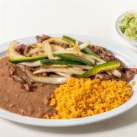 Carne Asada · Carne Asada Steak cooked fresh, topped with sautéed onions and jalapeño peppers. Served with...