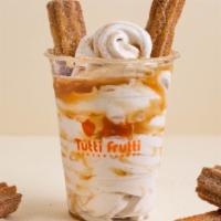 Churro Swirl · Gelato topped with churros and caramel.