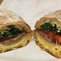 Roasted Tri-Tip Sandwich · Rosemary garlic seasoned tri-tip, swiss and jack cheese, garlic aioli, honey dijon aioli, an...