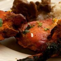 Chicken Tikka · Boneless chicken marinated in spicy yogurt sauce and cooked in Indian clay oven.
