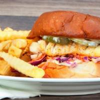 Grilled Fish Sandwich And Fries · Grilled wild pacific cod, cole slaw, pickles and tartar sauce.