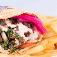 Chicken Shawarma Wrap · Fresh Wrap made with Marinated and flame broiled chicken, tomatoes, lettuce, garlic sauce an...