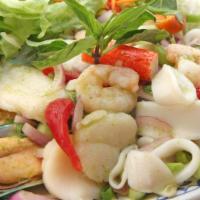 Spicy Seafood Salad · Mussels, shrimp, calamari, fish fillet, scallop, imitation crab tossed with house cilantro d...
