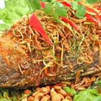 Whole Stripe Bass (Barramundi)  With Thai Herbs Sauce · Deep-fried to perfection topped with lemongrass, ginger, crispy ginger roots, kaffir leaves,...