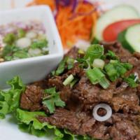 Crying Tiger · Grilled to order beef strips juicy and tender served with spicy citrus dressing.