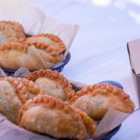 The 6 Pack · Enjoy six of our amazing empanadas. Select up to two options.