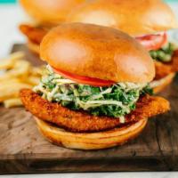 Crispy Chicken Sandwich · honey mustard kale slaw, pickles, brioche bun