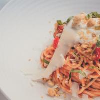 Spaghetti Pomodoro (Vegetarian) · Calabrian chili spiked tomato sauce, whipped ricotta, fresh basil, parmesan.