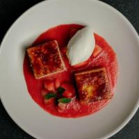 Crème Brûlée Cheesecake · Fresh strawberry compote, whipped cream