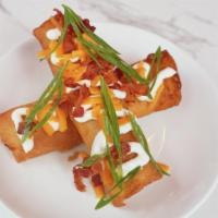 Crispy Mashed Potato · signature mashed potato in crispy wonton wrapper, fully loaded with bacon, cheddar cheese, s...