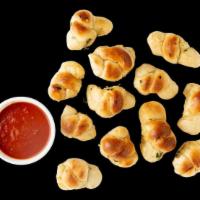 Garlic Knots X12 · Freshly Baked Knots, Extra Virgin Olive Oil, Garlic, Parsley.. Comes with Marinara Sauce.