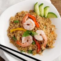 Basil Fried Rice · Thai style stir-fried rice in spicy sauce with egg, peppers , onion and basil.