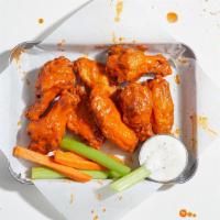 10 Chicken Wings · 10 chicken wings tossed in your choice of sauce. Served with ranch or blue cheese.