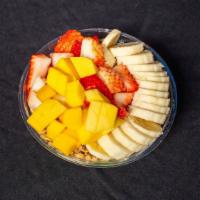 The Green Go Bowl · Mango, pineapple, banana, spinach, kale, almond milk, and agave. Topped with banana, strawbe...