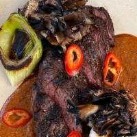 Hanger Steak · 8oz hanger steak | grilled leeks | maitake mushrooms | asada marinade | tortillas