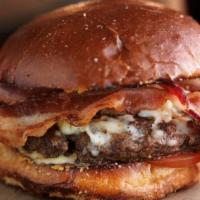 Bacon Cheeseburger · Grilled burger patty, crispy bacon, melted cheddar cheese, lettuce, tomato, mayo, burger bun.