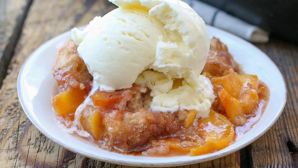 Crown Royal Peach Cobbler · Our Signature Dessert Crown royal peach cobbler can only be found here! Sweet juicey peach cobbler infused with your favorite Canadian Whisky aka CROWN ROYAL. This blend makes for a perfect dessert. (trademark by bite me dessert)