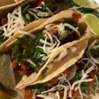 Tacos · steak, onions, cilantro, topped with cheese and mild or hot sauce.