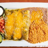 Enchilada Suizas · Three chicken enchiladas, tomatillo sauce, jack, cheddar, guacamole & sour cream.