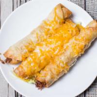 Taco Sticks · Three crispy flour tacos, shredded beef, jack, cheddar & guacamole.