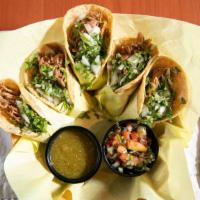 Taco Basket · Five soft tacos, guacamole, cilantro, onion, pico de gallo & salsa verde. Carne asada, pollo...