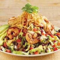 Southwest Avocado Shrimp Salad · Iceberg, romaine, a blend of three cheeses and tortilla strips tossed in chipotle ranch dres...