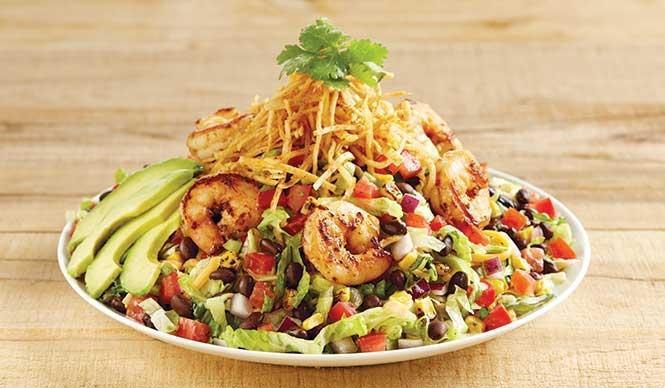 Southwest Avocado Shrimp Salad · Iceberg, romaine, a blend of three cheeses and tortilla strips tossed in chipotle ranch dressing. Topped with ancho-marinated shrimp, avocado, roasted corn, black beans and pico de gallo.