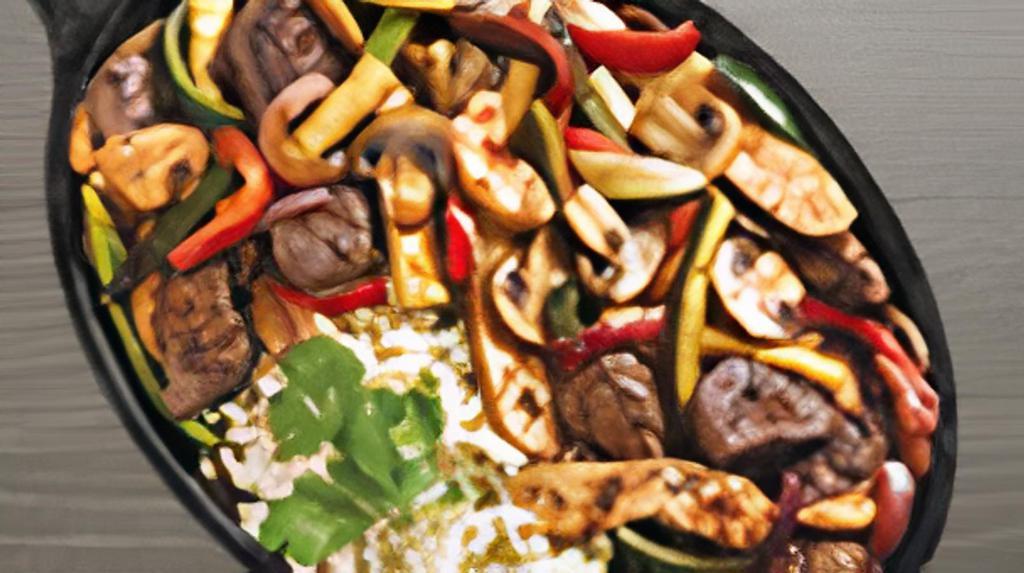 Spicy Beef & Chicken Savory Skillet · Spicy Beef & Chicken. Tender hanger beef tips and grilled chicken breast, fresh vegetables and mushrooms sautéed in a fajita marinade. With fresh herb rice and cilantro.