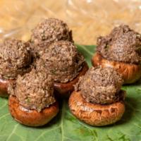 Marinated Stuffed Mushrooms · Portobello mushrooms stuffed with a mushroom pate. Mushrooms are de-stemmed and marinated in...