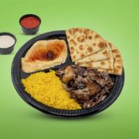 Beef Shawarma Plate · Layers of marinated beef & lamb fat cooked on a spit thinly sliced.