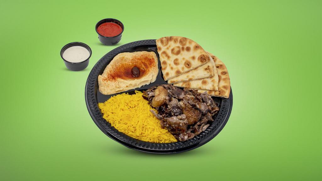 Beef Shawarma Plate · Layers of marinated beef & lamb fat cooked on a spit thinly sliced.
