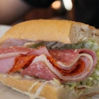 Woodstone · Salami, ham, pepperoni, mozzarella, our red sauce, lettuce and peppers.