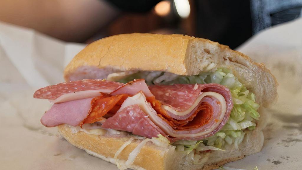 Woodstone · Salami, ham, pepperoni, mozzarella, our red sauce, lettuce and peppers.