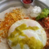 Huevos Rancheros · A big flour tortilla topped with three eggs any style and filled with rice, beans, chorizo, ...