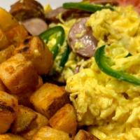 Jalapeno Sausage Scrambled · Scrambled eggs, Organic Chicken Sausage, Jalapeños, Breakfast Potatoes with Bread and Butter.
