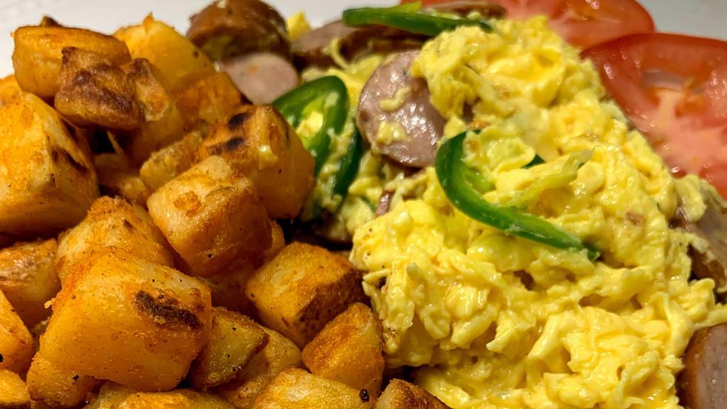 Jalapeno Sausage Scrambled · Scrambled eggs, Organic Chicken Sausage, Jalapeños, Breakfast Potatoes with Bread and Butter.