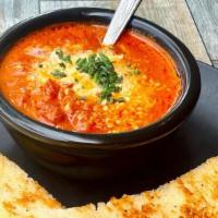 Tomato Basil Soup · Tomato, basil, cream, and thyme.