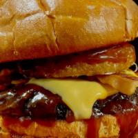 Kids Buckaroo Burger · Burger patty, BBQ sauce, onion ring, pickles, bacon and American cheese.