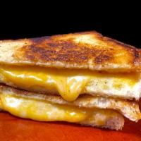 Grilled Cheese · Colby Jack cheese melted in between two sliced of grilled sourdough