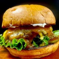 Kids Whippersnapper Burger · Burger patty, ketchup, lettuce, pickles and a slice of American cheese.