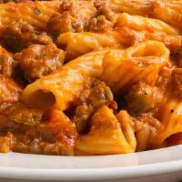 Sausage & Peppers · Italian sausage - onions - peppers - rigatoni - red sauce.