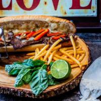 Philly Cheesesteak Sandwich · Delicious steak grilled to perfection with mushrooms, bell peppers and onions, covered with ...