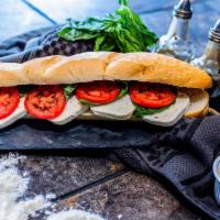 Veggie Sandwich · Lettuce, tomatoes, artichokes, black olives, red onions, mozzarella cheese, mustard and mayo...